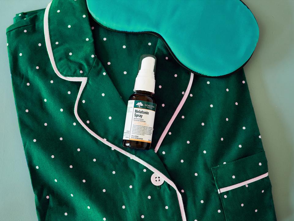 a-bottle-of-medicine-on-a-green-shirt-with-a-sleeping-mask